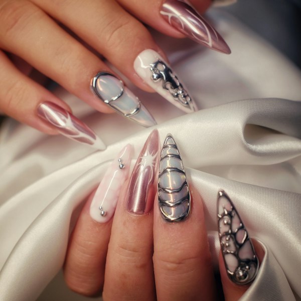 Metallic chrome stiletto nails with jewelled details